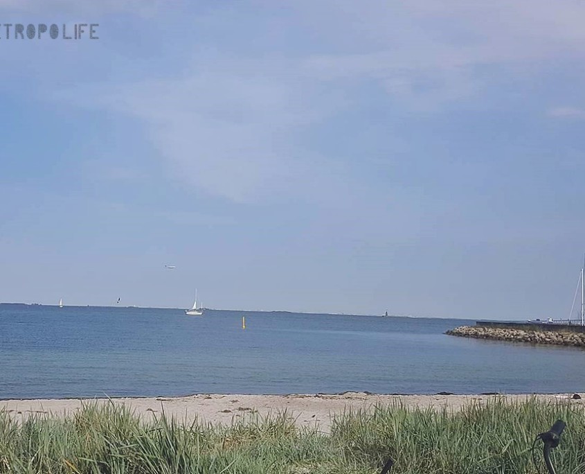 Amager Beach with planes and boats in the background